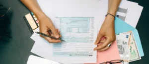 A person is cutting paper with scissors.